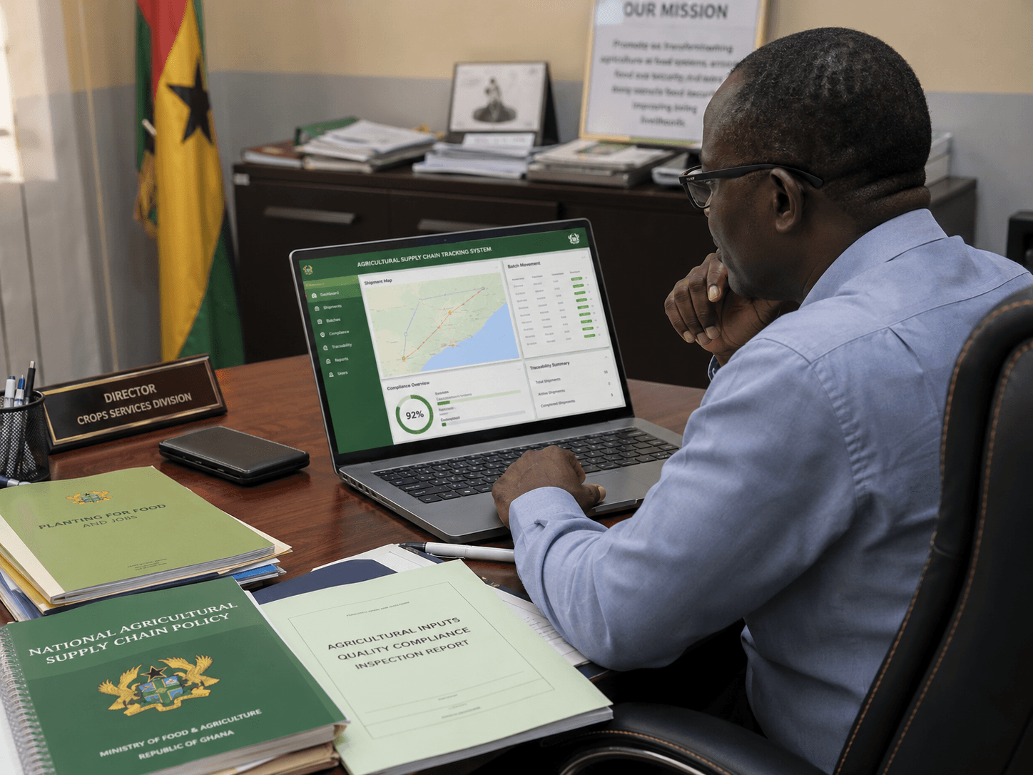 Government agricultural official reviewing supply chain data on a laptop